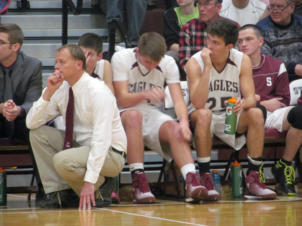 Coach Dwayne Carter watches from the bench