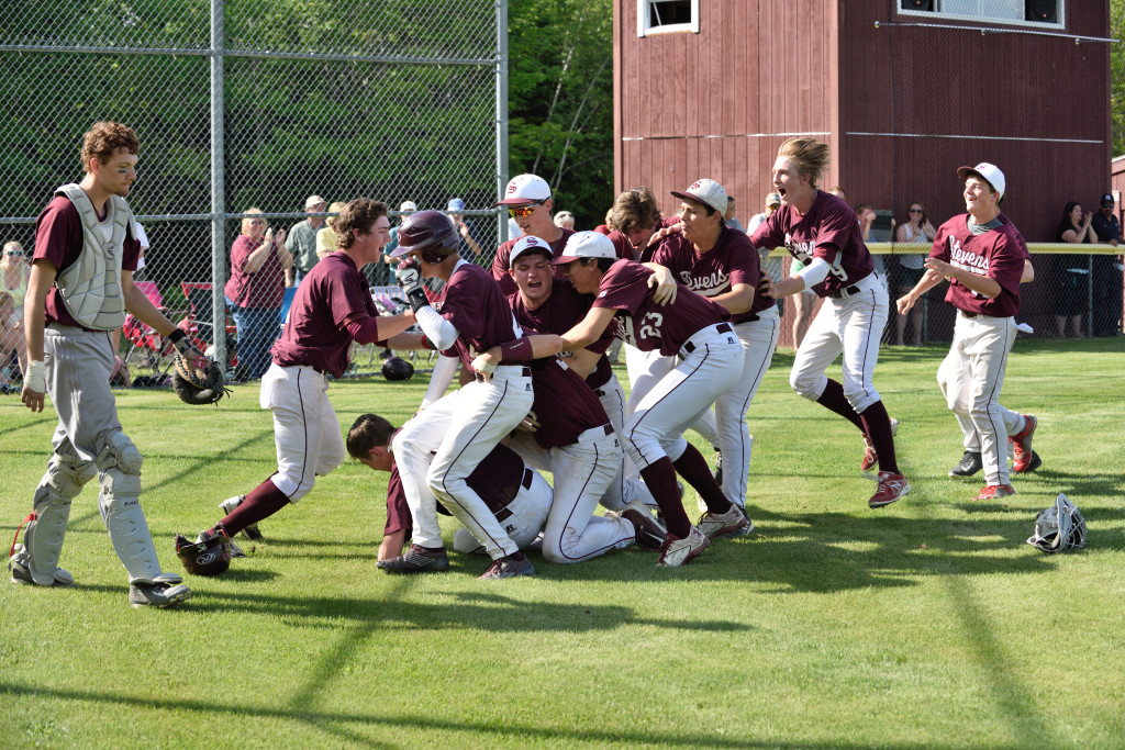 The Eagles celebrate a 10th inning to move to the Eastern finals. Photo by Franklin Brown