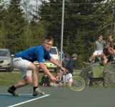 Cameron lunges for a backhand return
