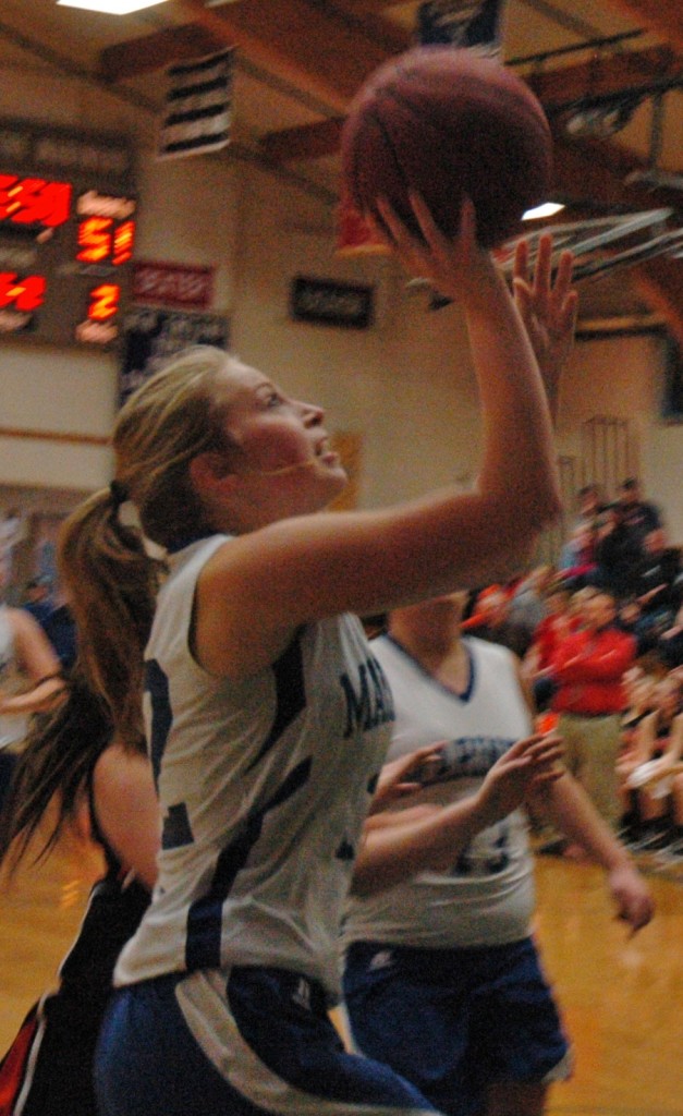 Mariner Natalie Knowlton lays it in against Shead. Photo by Jack Scott