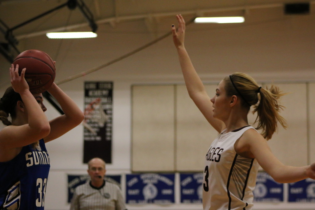 Hannah Peasley defends against Sumner. PHoto by Anne Berleant