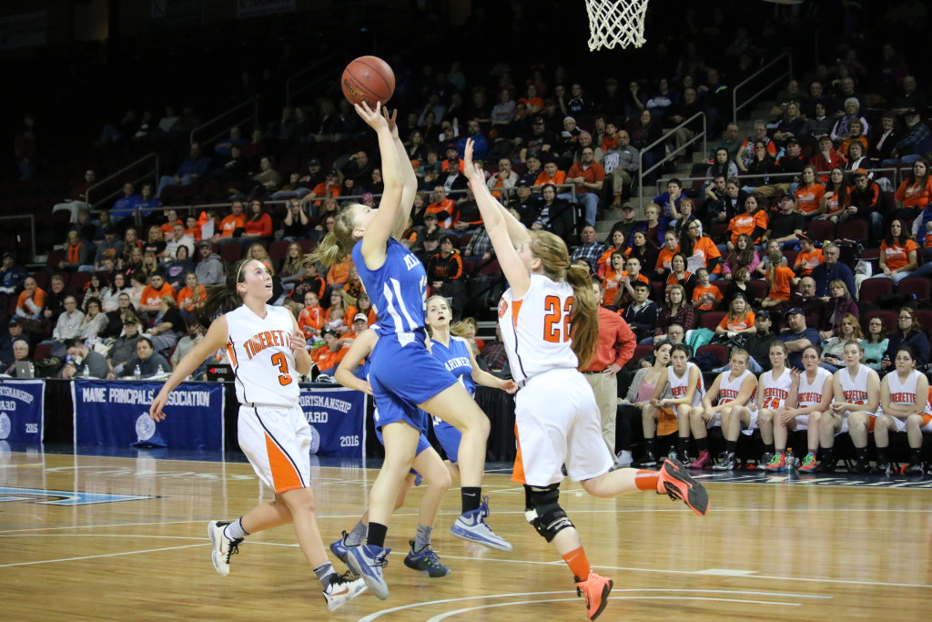 Mariner Natalie Knowlton goes for a lay up at the quarterfinal matchup. PHoto by Anne Berleant