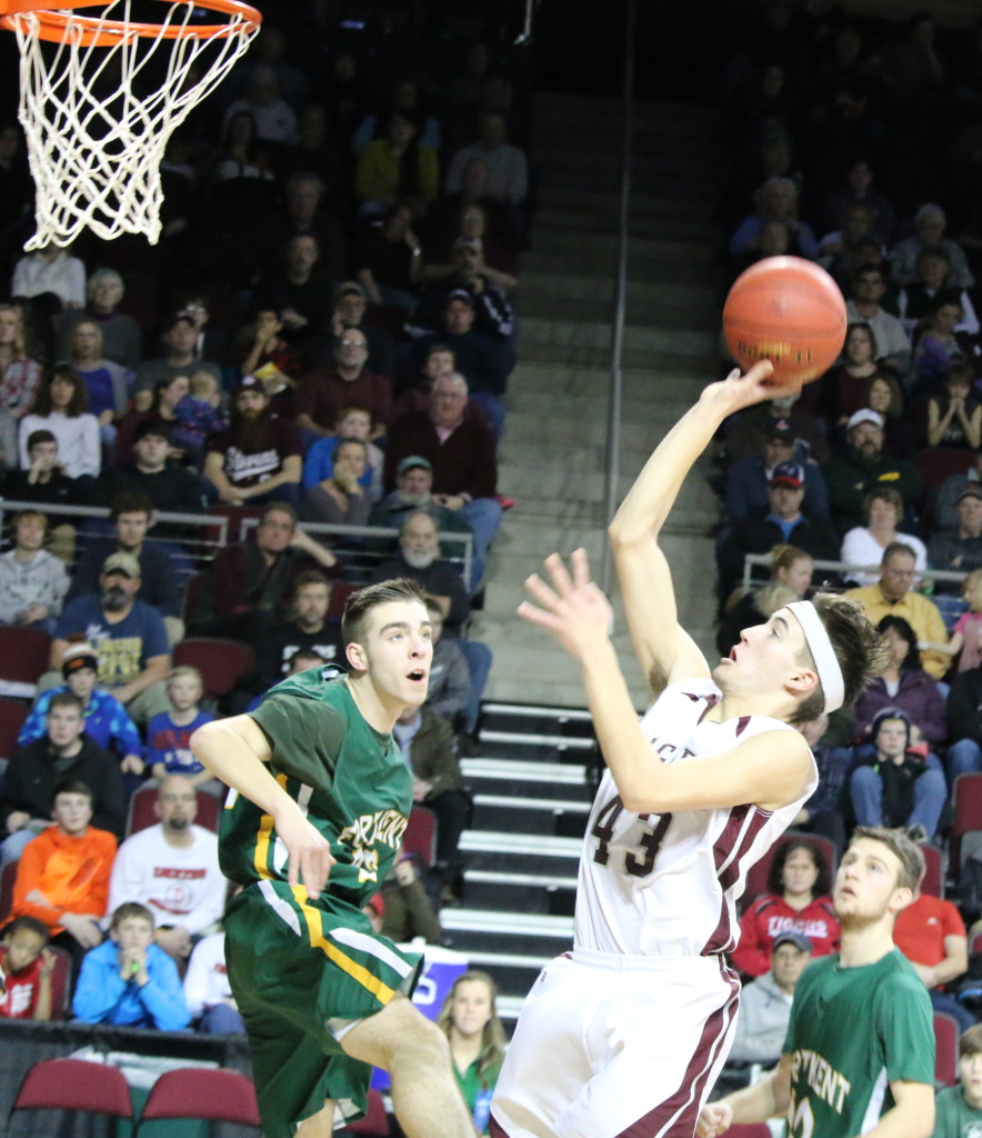 Jarrod Chase lays it up against Fort Kent at the Cross Center. Photo by Anne Berleant