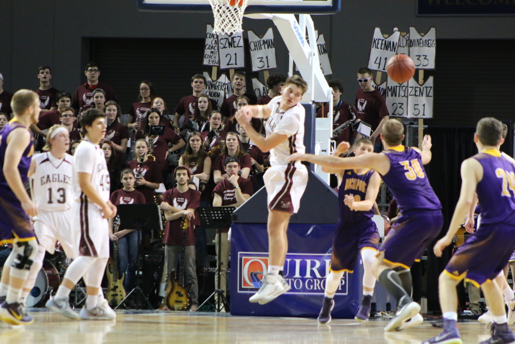 Senior Nick Szwez defends at the post. Photo by Anne Berleant