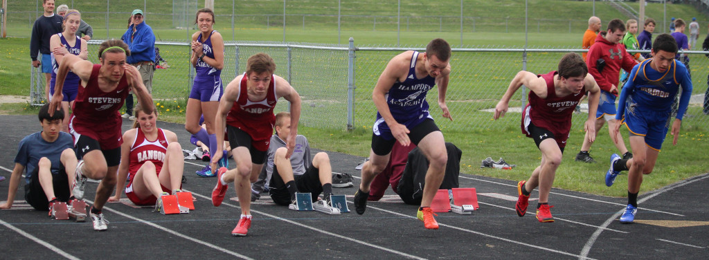 Walker Ellsworth, at left, competes in the 110 meter hurdle event. Photo by John Richardson