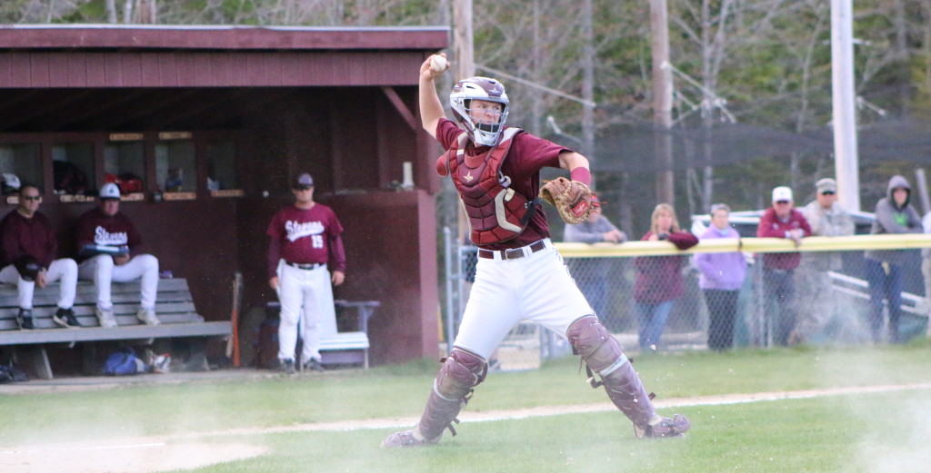 Dakota Chipman heaves a throw down the first baseline for the out. Photo by Monique Labbe