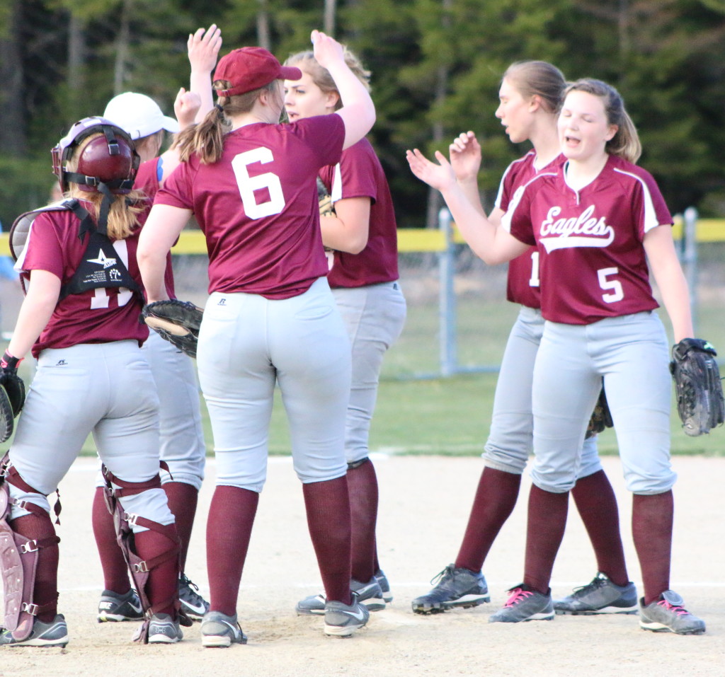 The George Stevens Academy infield huddles before the start of the inning. Photo by Monique Labbe