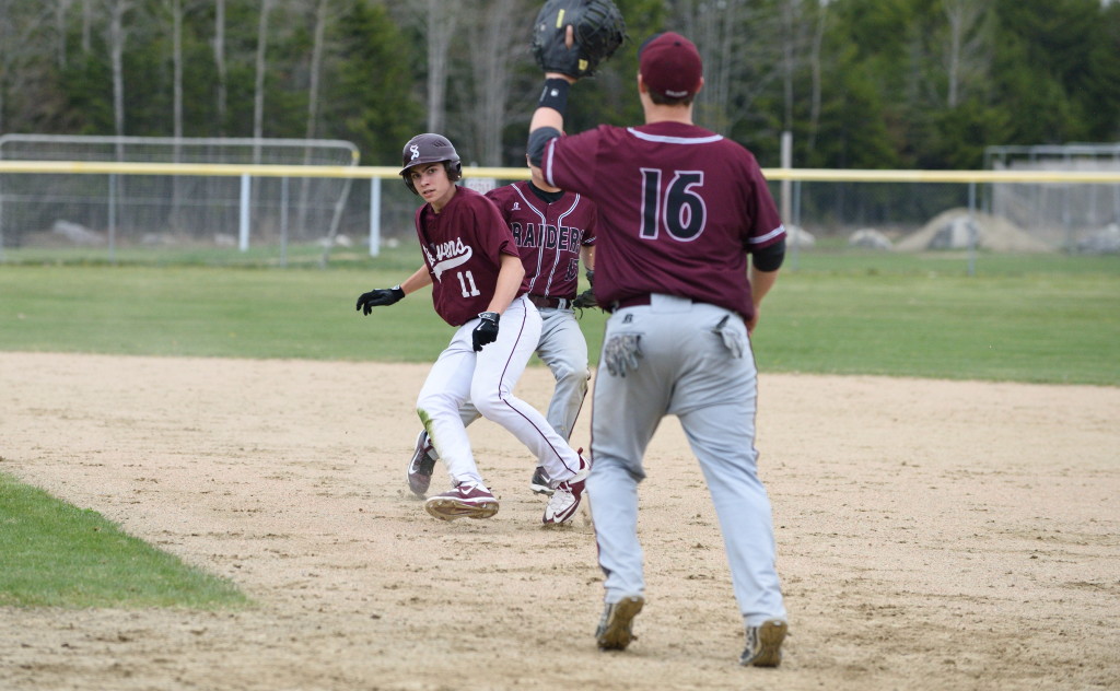 Will Entwisle tries to dodge the he tag out . Photo by Franklin Brown