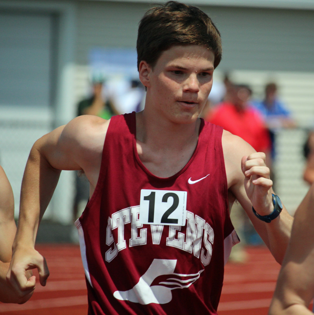 Erik Taylor-Lash wins the state medal for the 1600 meter race walk. Photo by John RIchardson