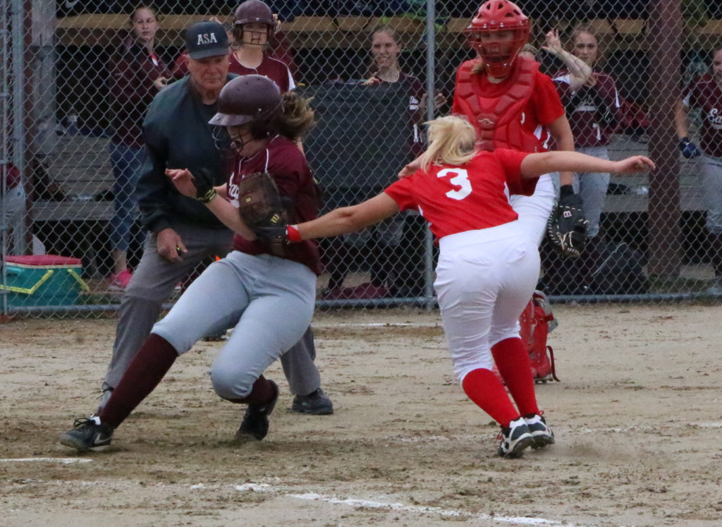 Lily Cox races for home plate against Dexter. Photo by Anne Berleant