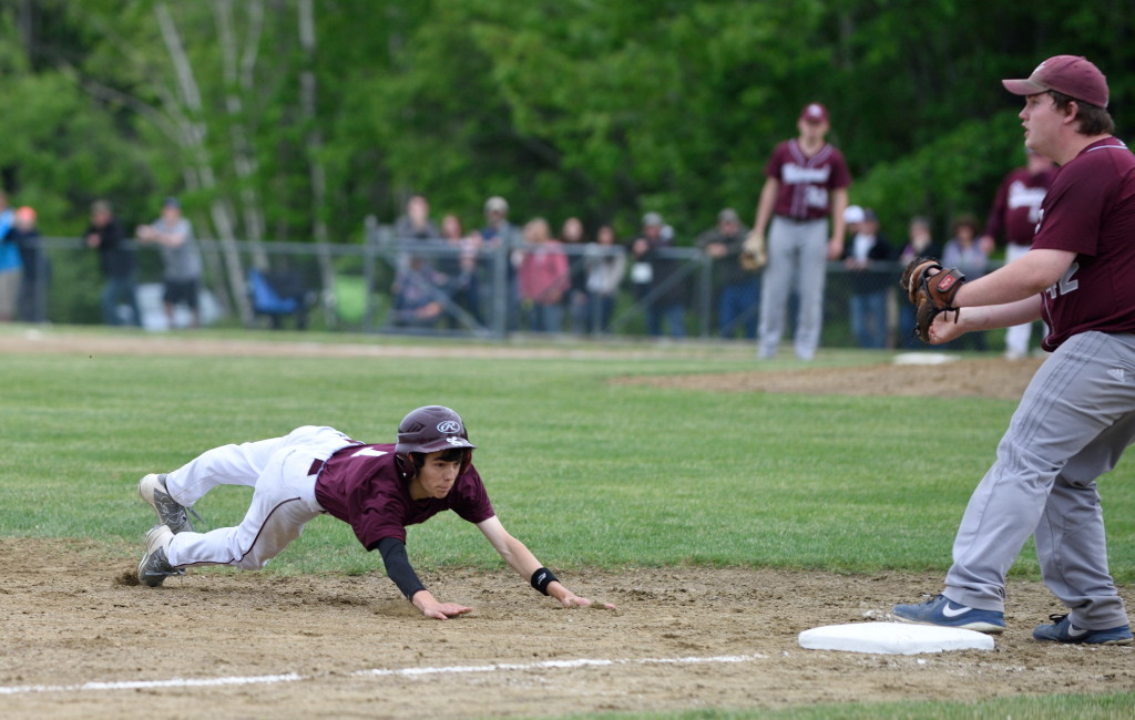 Nick Norton dives for third base in the sixth inning of the semifinal.  Photo by Franklin Brown