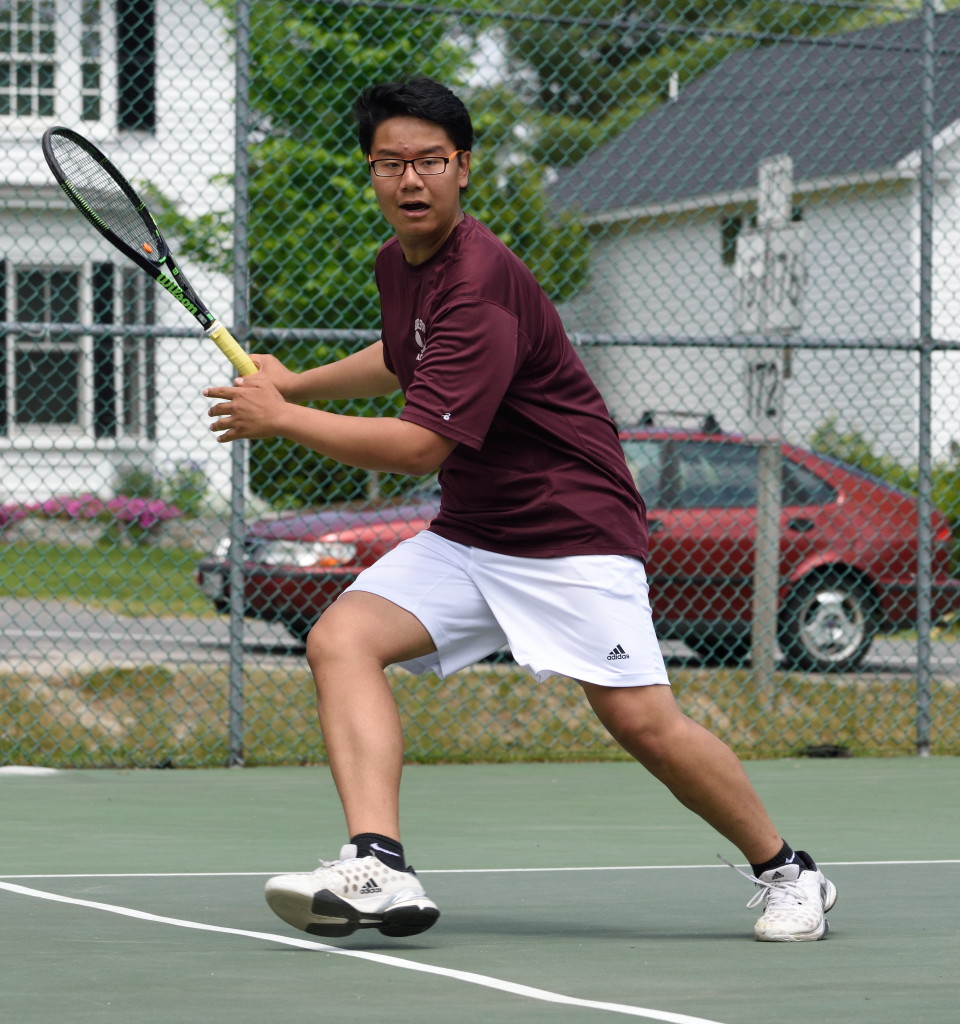 Doubles player Kent Fang  returns against Fort Kent.  Photo by Franklin Brown