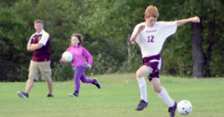 Ethan Vinall heads off a kick. Photo by Anne Berleant