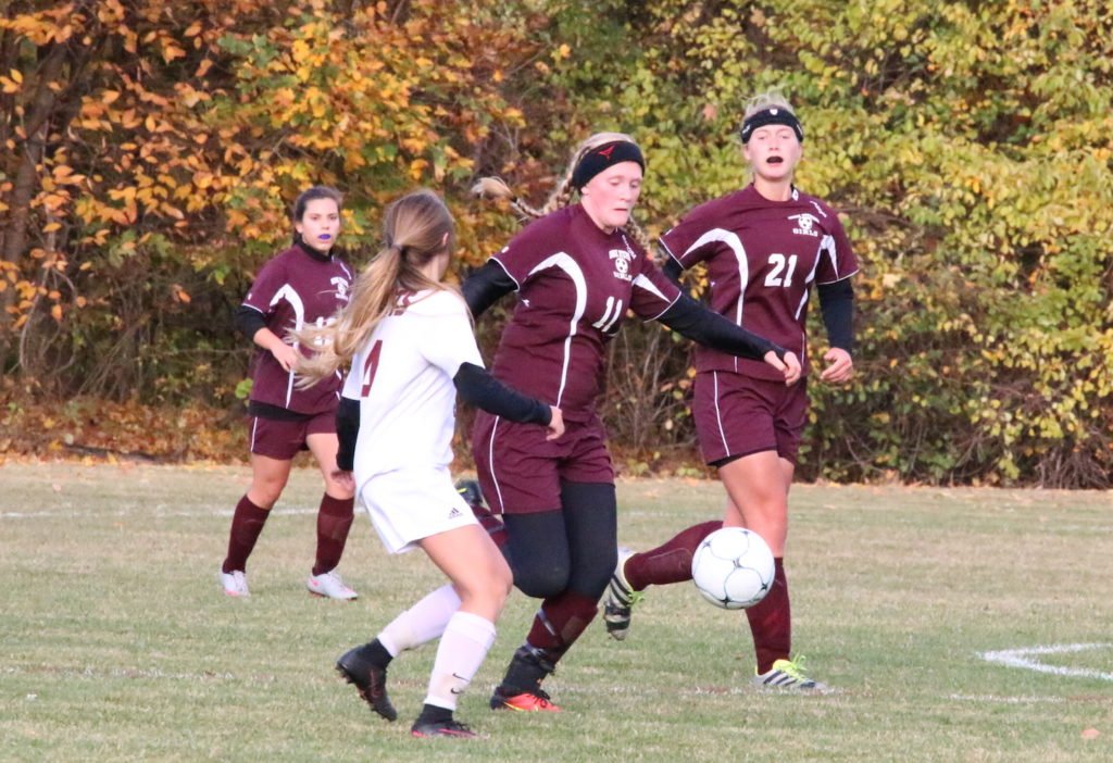 Elinor Haldane beats out an Orono midfielder for the ball. Photo by Monique Labbe