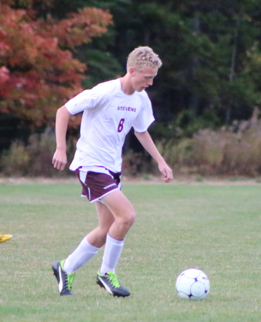 Eagle Jeremiah Scheff works the ball. Photo by Anne Berleant