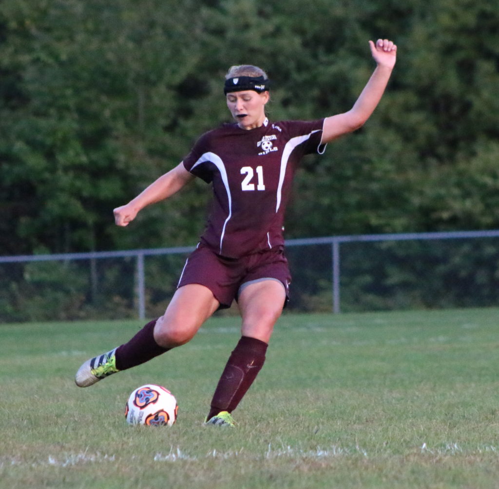 Morgan Dauk kicks it in for a last, winning play for George Stevens. photo by Anne Berleant