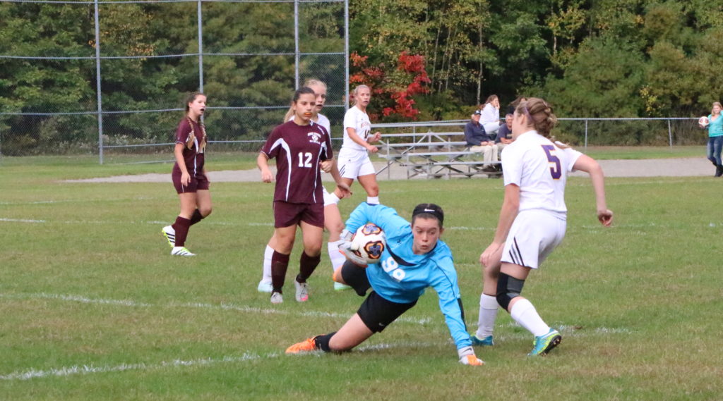 Goalkeeper Bess MacArthur saves 10 of 18 shots twoards the win. Photo by Anne Berleant