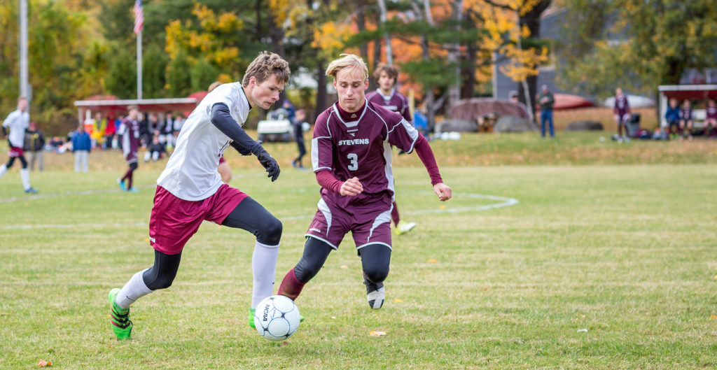 Sam Scheff defends the ball. Photo by Tate Yoder