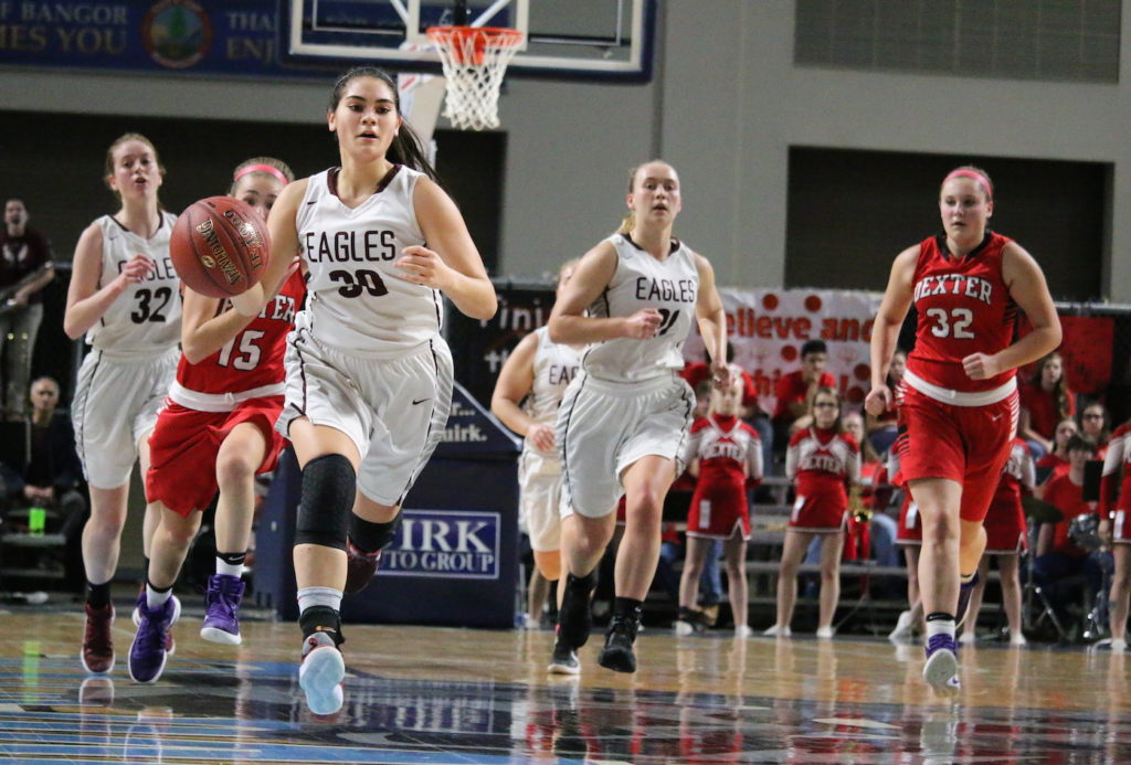 Julianna Smallidge steals and takes the fast break. Photo by Anne Berleant