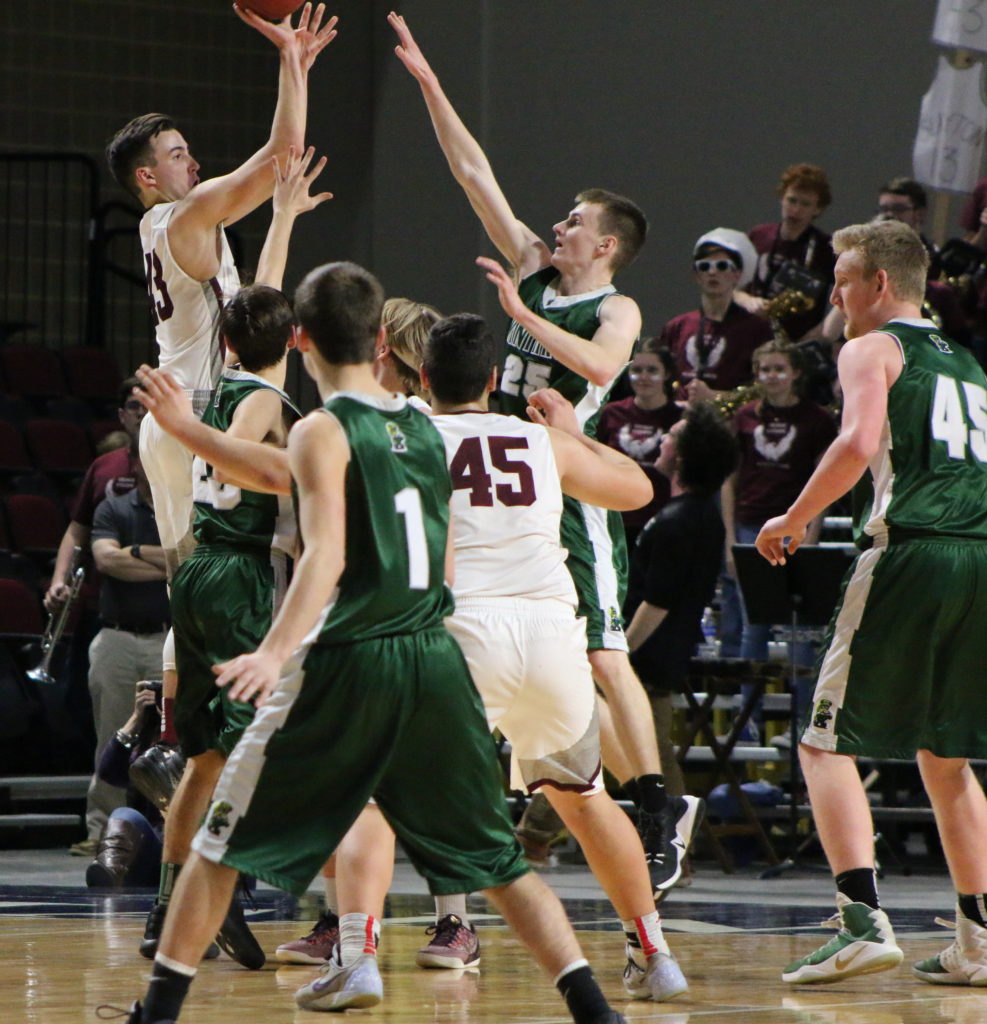 Jarrod Chase takes a contested shot. Photo by Anne Berleant