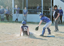 Lily Gray tries to beat a slide into home plate. Photo by Jack Scott
