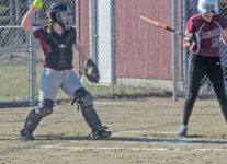 Senior Sarah Mullen returns a pitch. Photo by Anne Berleant