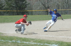 Silas Bates slides home against Katahdin. Photo by Jack Scott