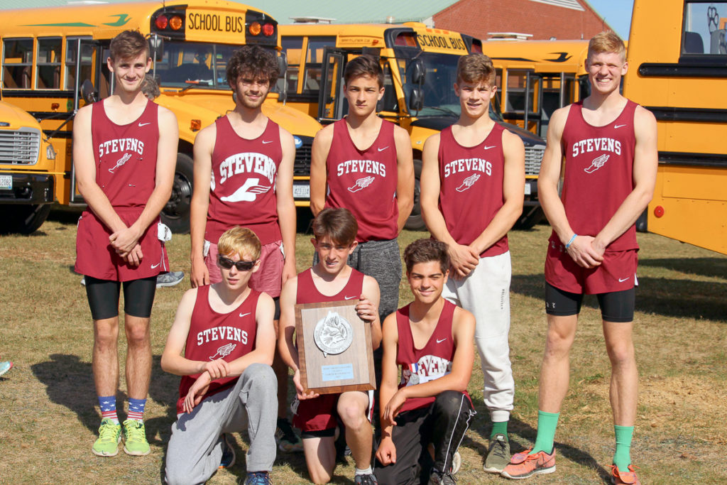 The Eagle boys team display their second-place plaque