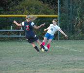 Lowery works to control the ball