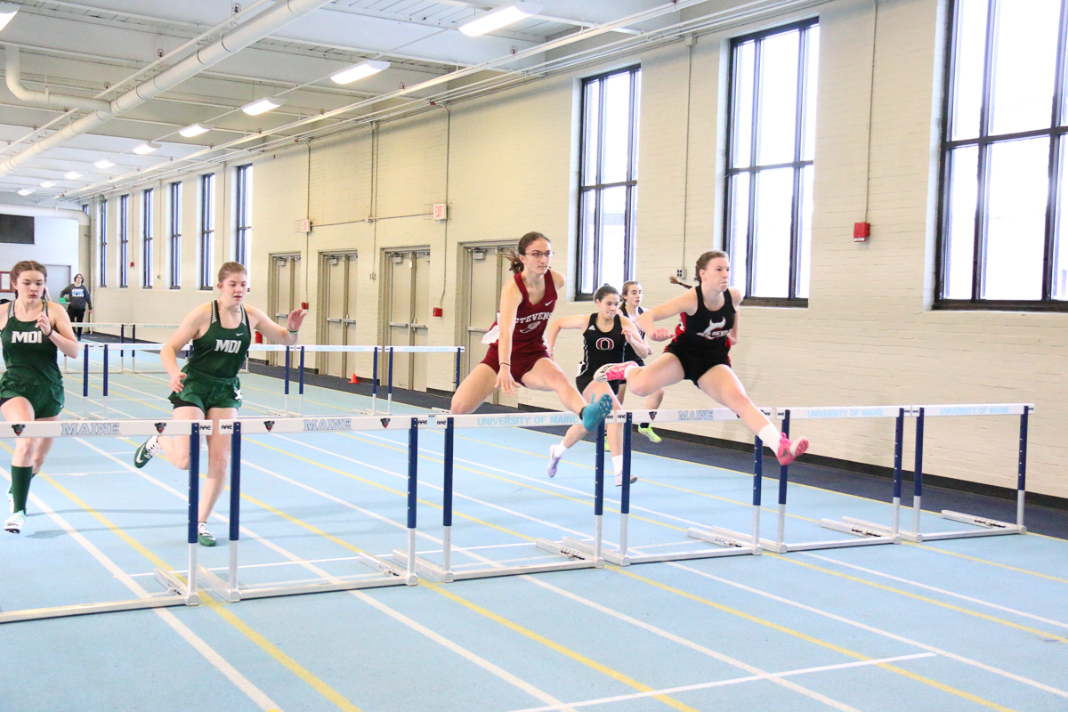 Grace Broughton clears a hurdle