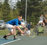 Cameron lunges for a backhand return