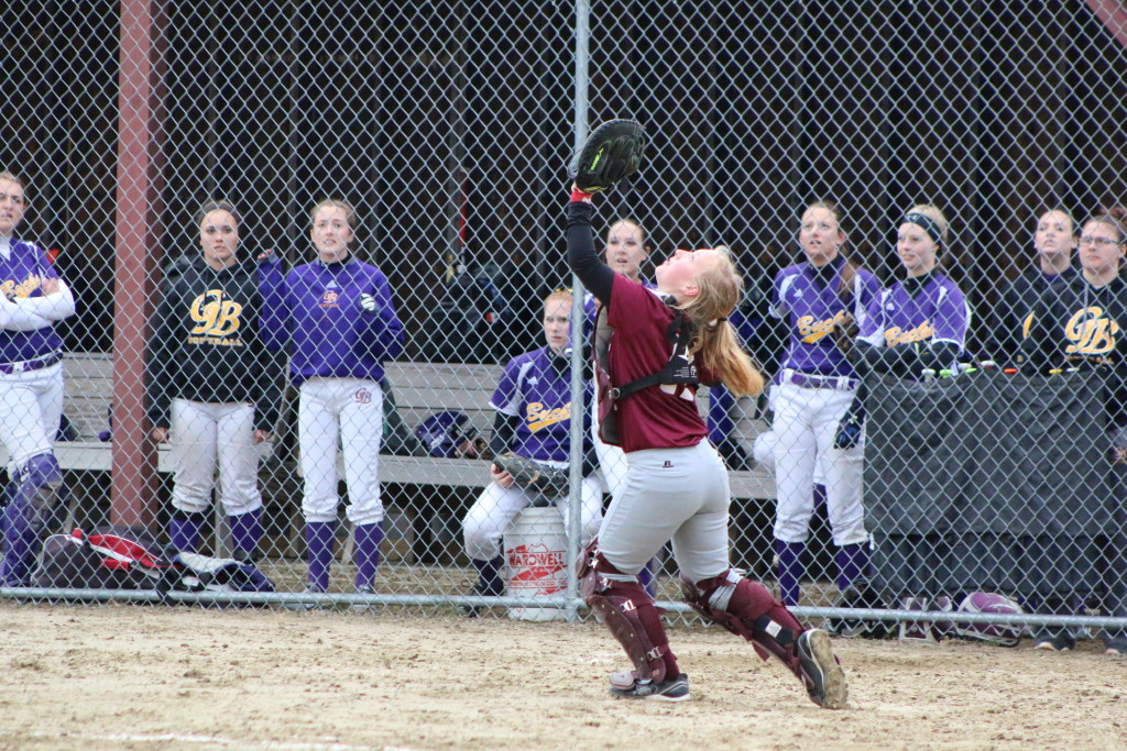 Catcher Sarah Mullen makes a play on an infield pop fly. Photo by Monique Labbe