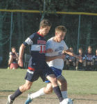 DIS' Mason Oliver battles for the ball. Photo by Jack Scott
