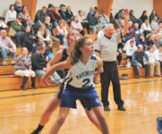Orley Vaughn boxes out at the net. Photo by jack Scott