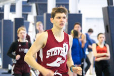 John Hassett takes first in distance events. Photo by John Richardson