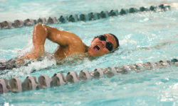Alexander Yap swims the men's 50 Yard freestyle. Photo by Franklin Brown