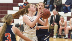 Mazie Smallidge maneuvers for a shot against Penquis. Photo by Franklin Brown