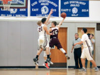 Jarrod Chase and Max Mattson block a shot