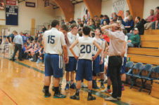 Coach Rufus Nicoll rallies the team against Jonesport. Photo by Jack Scott