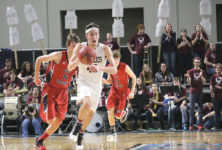 Jarrod Chase drives down court. Photo by Anne Berleant