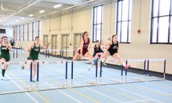 Grace Broughton clears a hurdle